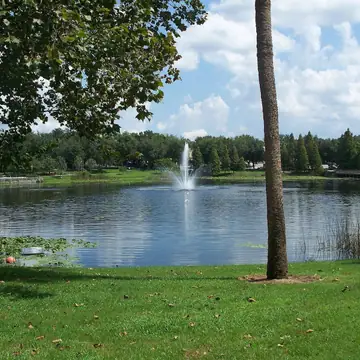 Lake Lily and its fountain from the lawn at Lake Lily Park, Maitland