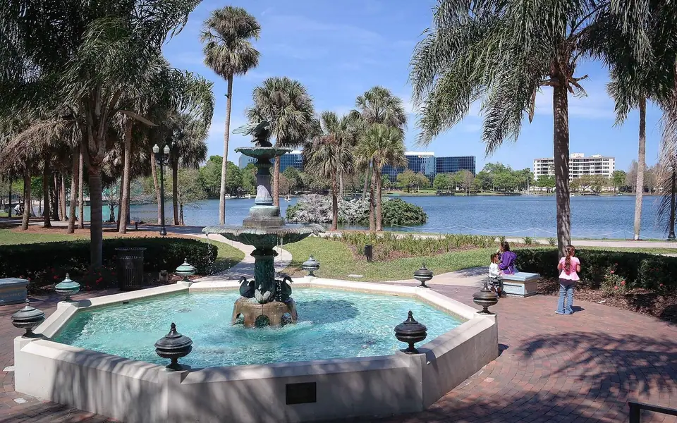 The Frank Sperry Fountain at Lake Eola Park, downtown Orlando, with the lake and skyline behind it